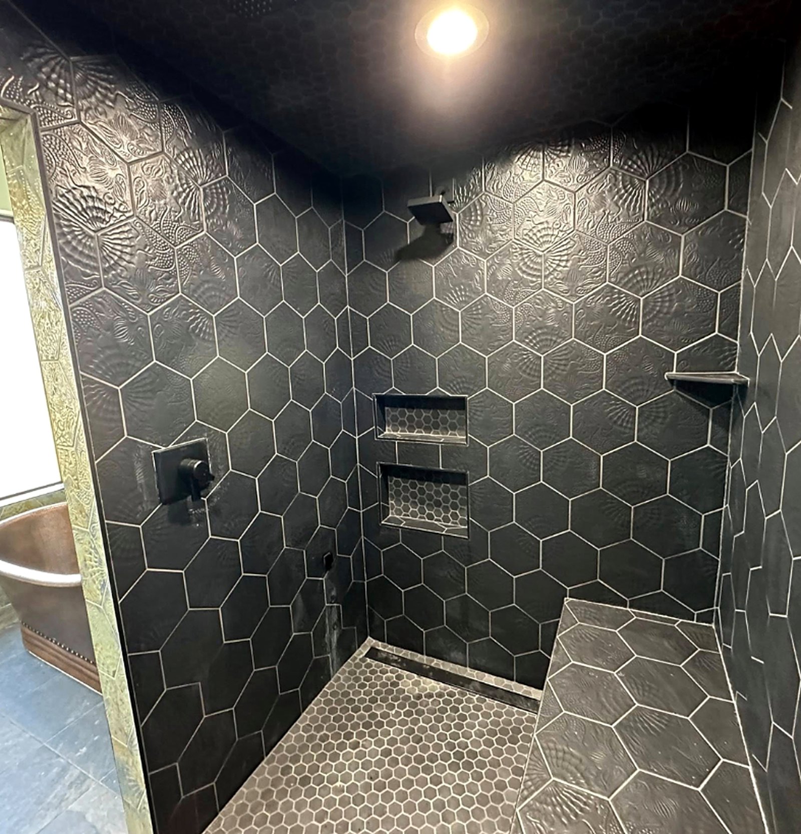 Charcoal hexagon tile walk-in shower
